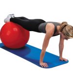 female working out using exercise ball