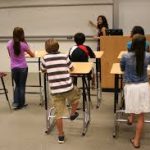 Kids standing at desk learning about a healthy lifestyle