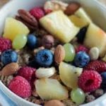 colorful bowl of healthy fruits and nuts