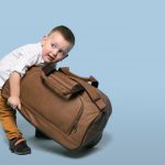 Child carrying heavy bag needs a child chiropractor in Guelph